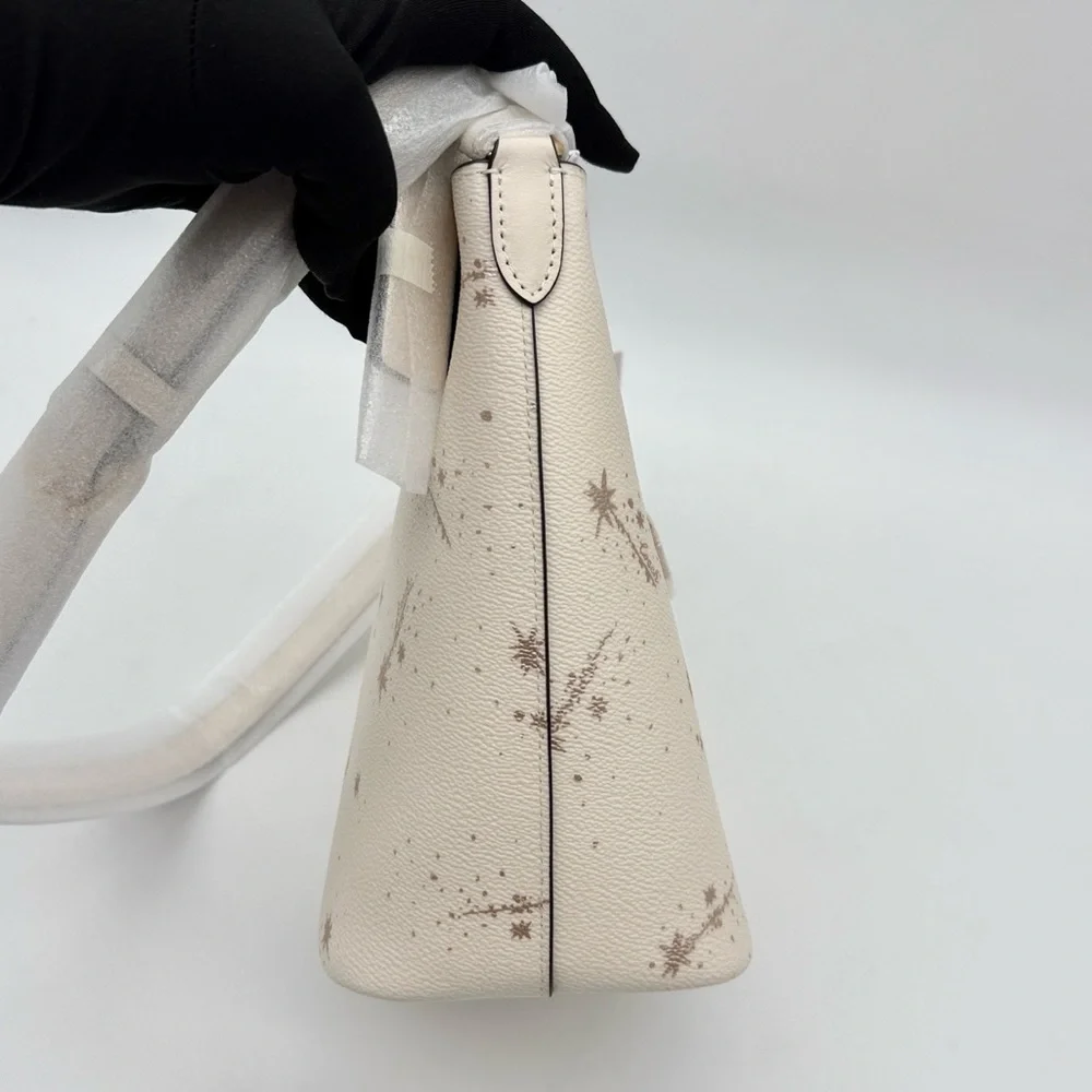 Coach Logan Duffle Bag With Star Print Chalk Cream